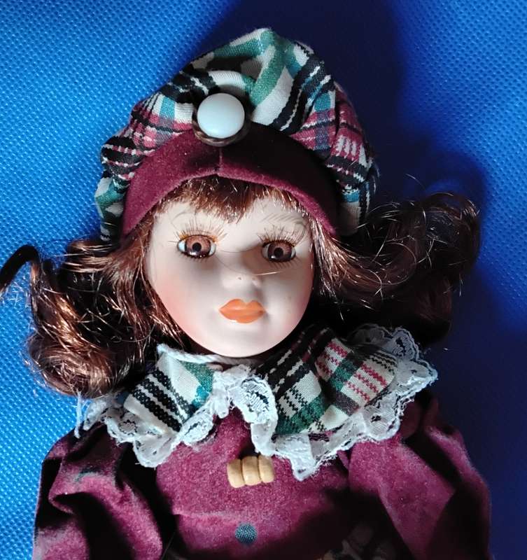 Small Vintage Porcelain Doll in sitting Position