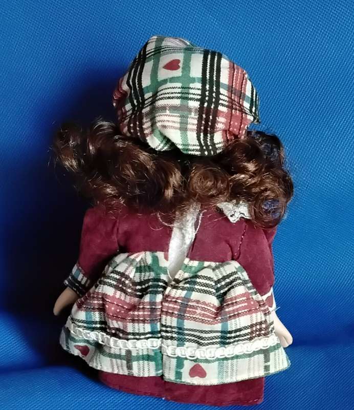 Small Vintage Porcelain Doll in sitting Position