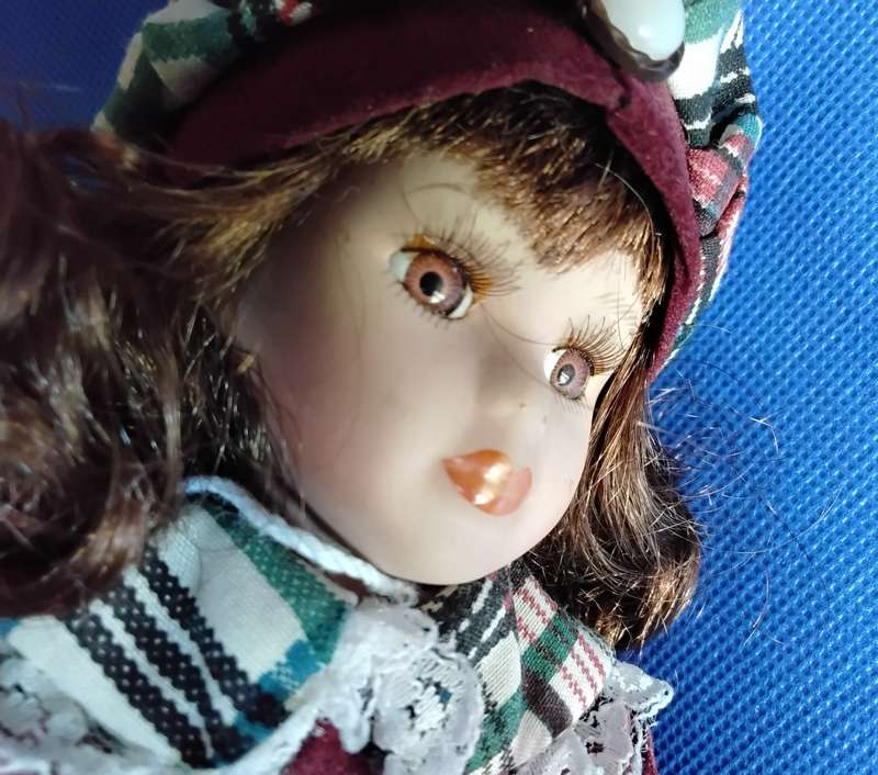 Small Vintage Porcelain Doll in sitting Position