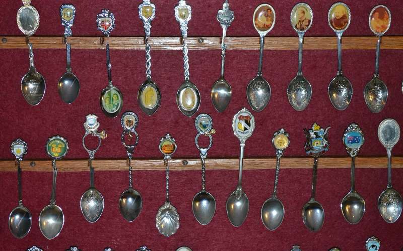 Large Collection of  Vintage Souvenir / Collectable Spoons in Display Case