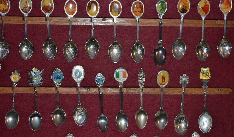 Large Collection of  Vintage Souvenir / Collectable Spoons in Display Case
