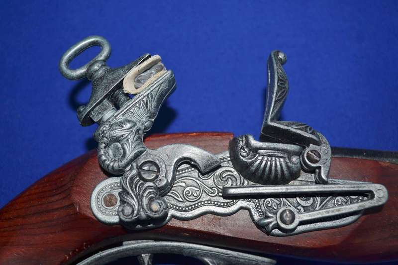 Vintage Replica Antique Snaphance Pistol Displayed on wooden frame
