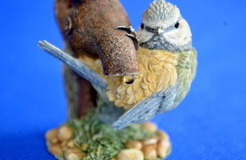 A Pair of Small Resin Bird Ornaments by CA