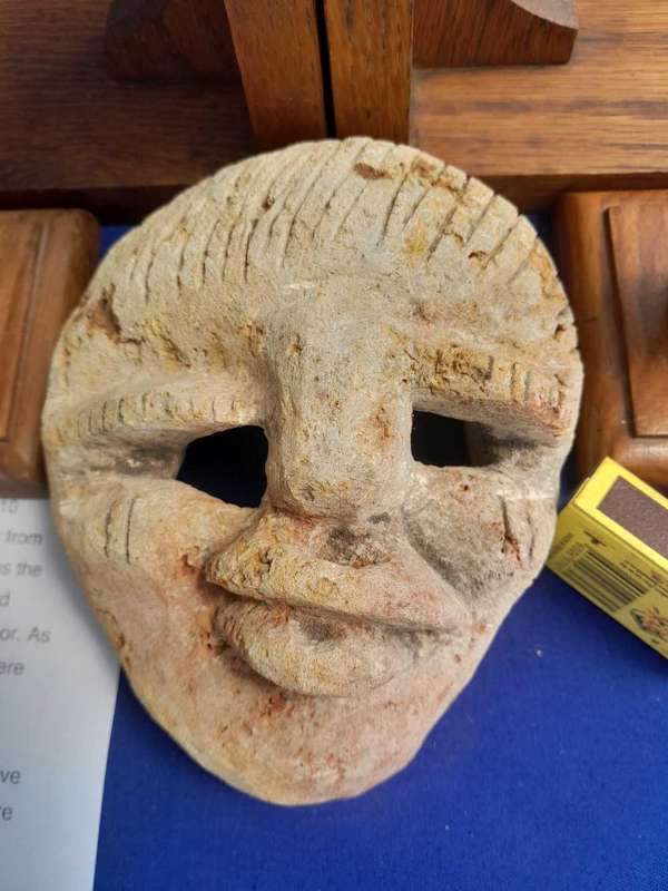 Fossilized  Carved Coral  Animist Mask on assembled Wooden Stand