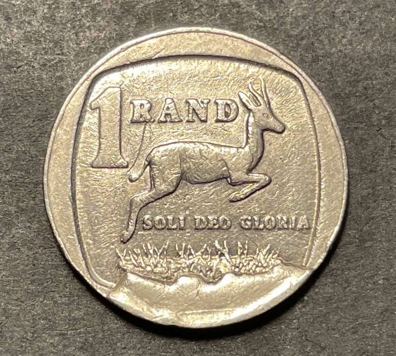 Nice 1994 Error RSA 1 Rand coin with a large cud error (Broken die)