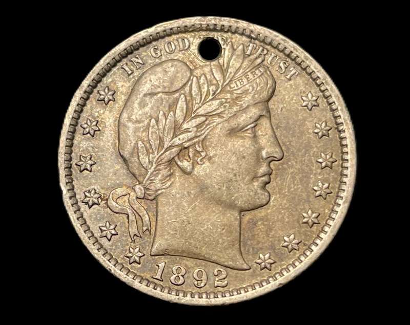 Rare Key date 1892 USA silver Barber Quarter coin in an +/- AU condition but unfortunately holed