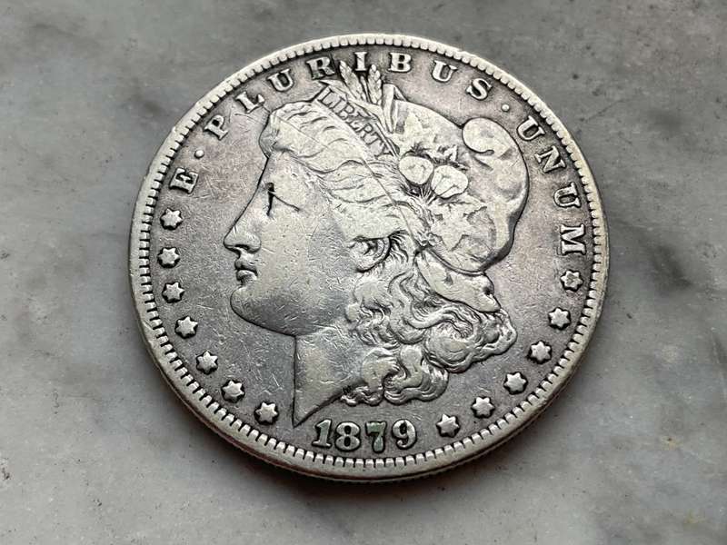 Early American silver Morgan one dollar coin from 1879 - 146-year-old Crown sized coin