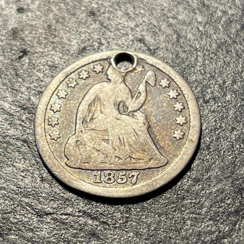 Small silver 1857 American 5 cent (half of a dime)) coin