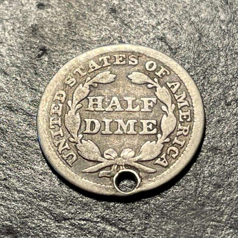 Small silver 1857 American 5 cent (half of a dime)) coin