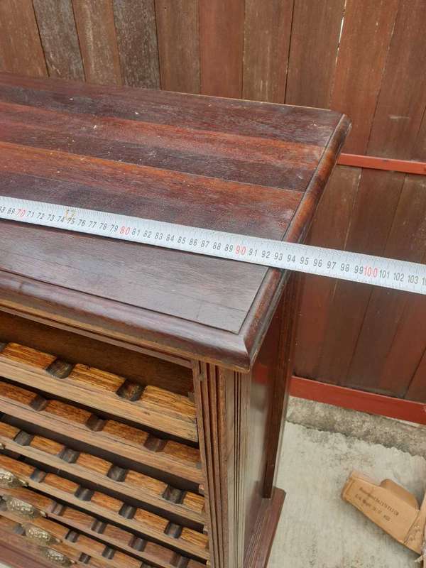 56 bottle antique mahogany wood wine rack with brass handles.