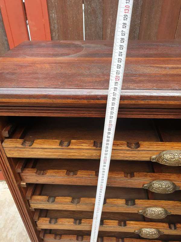 56 bottle antique mahogany wood wine rack with brass handles.