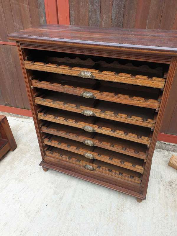 56 bottle antique mahogany wood wine rack with brass handles.
