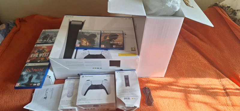 PS5 plus 5 games, 2 remotes, Charging stand and Media remote