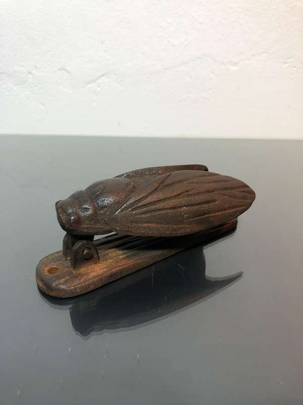 A Heavy Cast Iron Cicada Door Knocker.