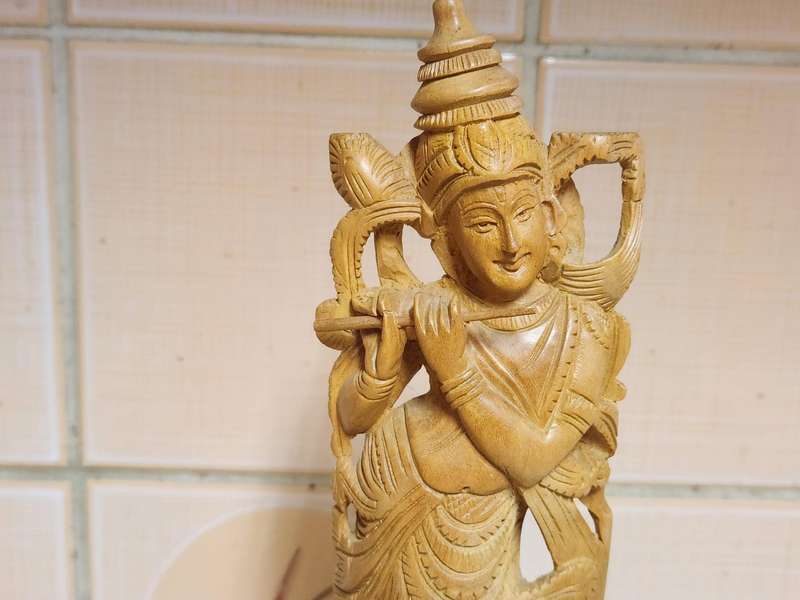 VINTAGE ELABORATELY CARVED WOODEN STATUE, DEPICTING LORD KRISHNA PLAYING THE FLUTE