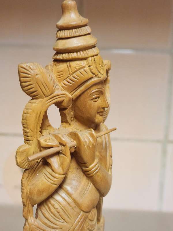 VINTAGE ELABORATELY CARVED WOODEN STATUE, DEPICTING LORD KRISHNA PLAYING THE FLUTE