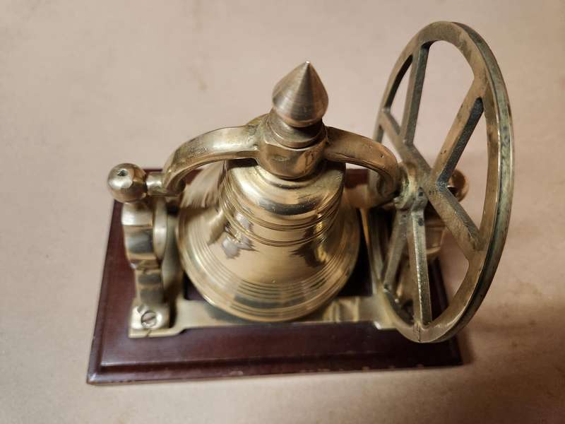 VINTAGE SOLID BRASS DESKTOP NAUTICAL BELL ON A WOODEN PLINTH