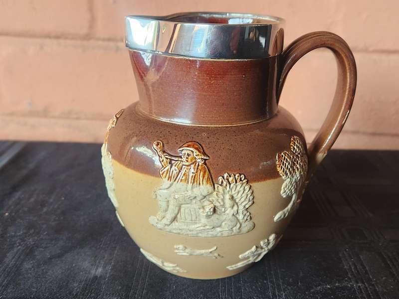 LATE VICTORIAN DOULTON LAMBETH JUG WITH A HALLMARKED SILVER RIM