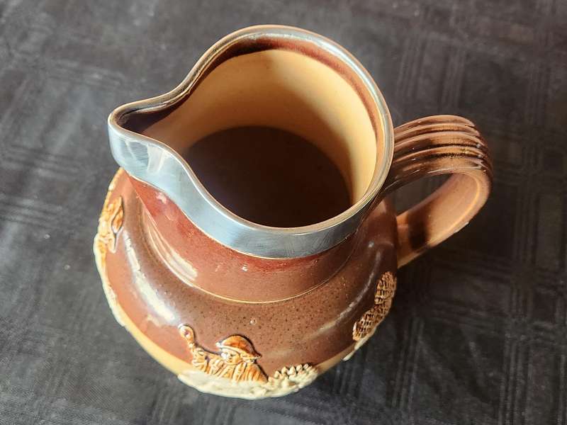 LATE VICTORIAN DOULTON LAMBETH JUG WITH A HALLMARKED SILVER RIM