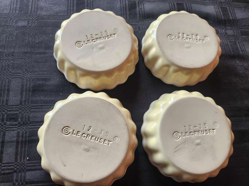 FOUR LE CREUSET FLUTED FLAN DISHES: 12 - 35