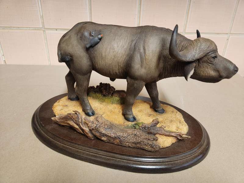 THE SILKWOODS OF KNYSNA MILLENIUM BUFFALO SCULPTURE ON A WOODEN BASE