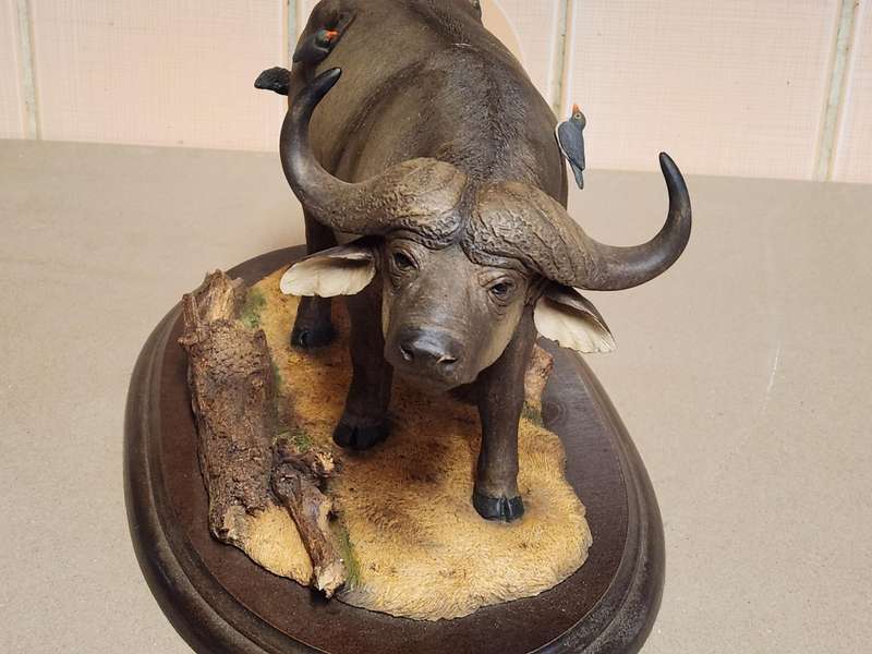 THE SILKWOODS OF KNYSNA MILLENIUM BUFFALO SCULPTURE ON A WOODEN BASE