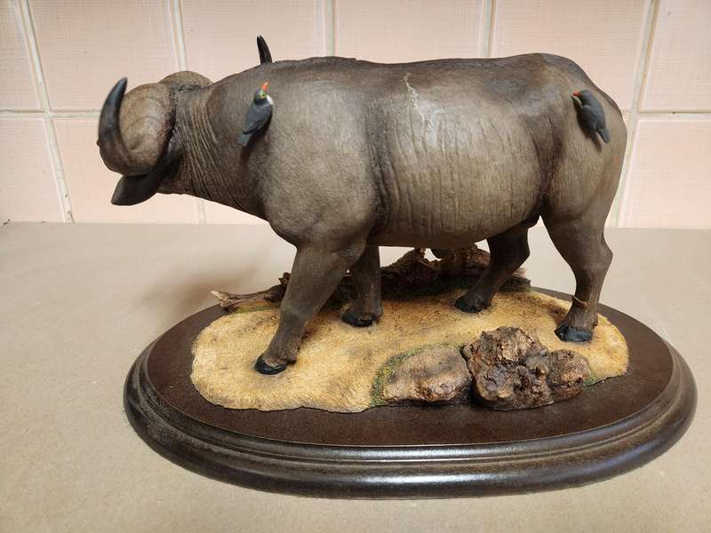 THE SILKWOODS OF KNYSNA MILLENIUM BUFFALO SCULPTURE ON A WOODEN BASE