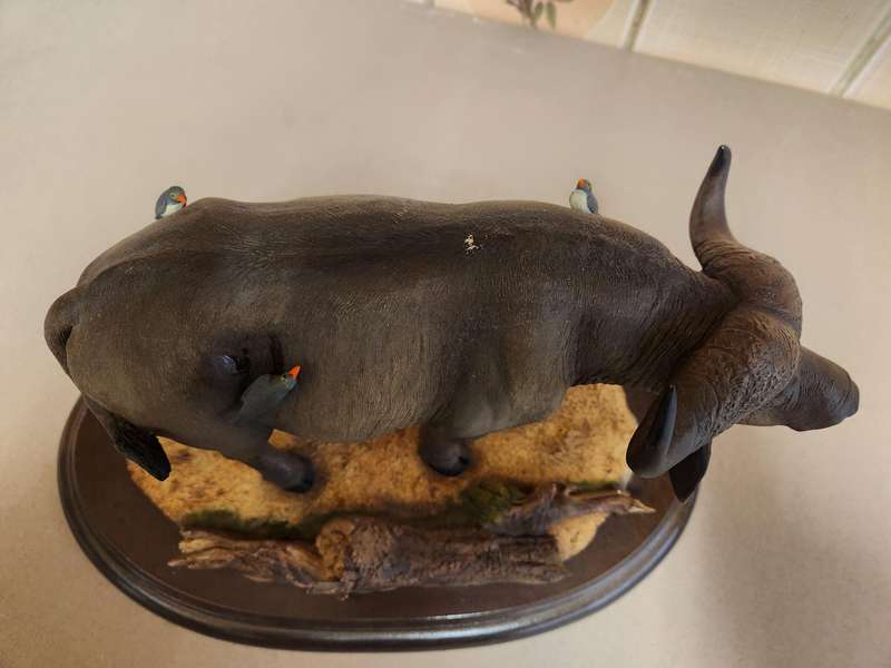 THE SILKWOODS OF KNYSNA MILLENIUM BUFFALO SCULPTURE ON A WOODEN BASE
