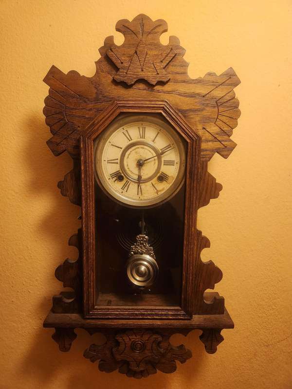 Vintage Ansonia Wall Clock in an Ornate Oak Casing