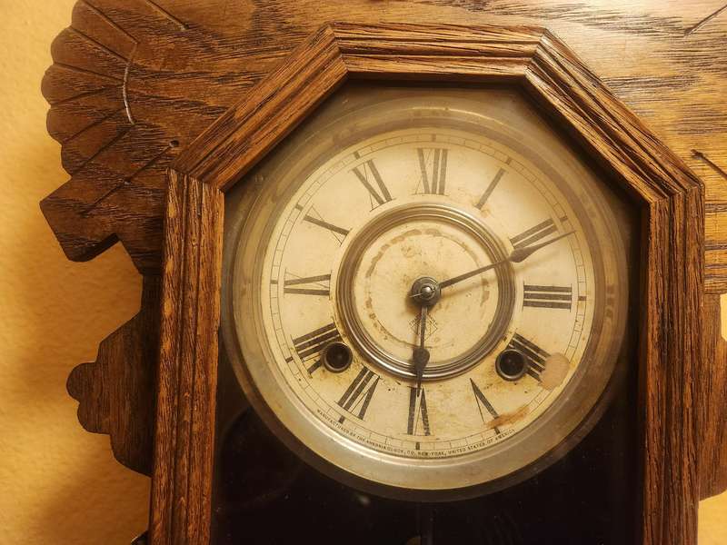 Vintage Ansonia Wall Clock in an Ornate Oak Casing