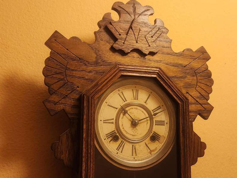 Vintage Ansonia Wall Clock in an Ornate Oak Casing