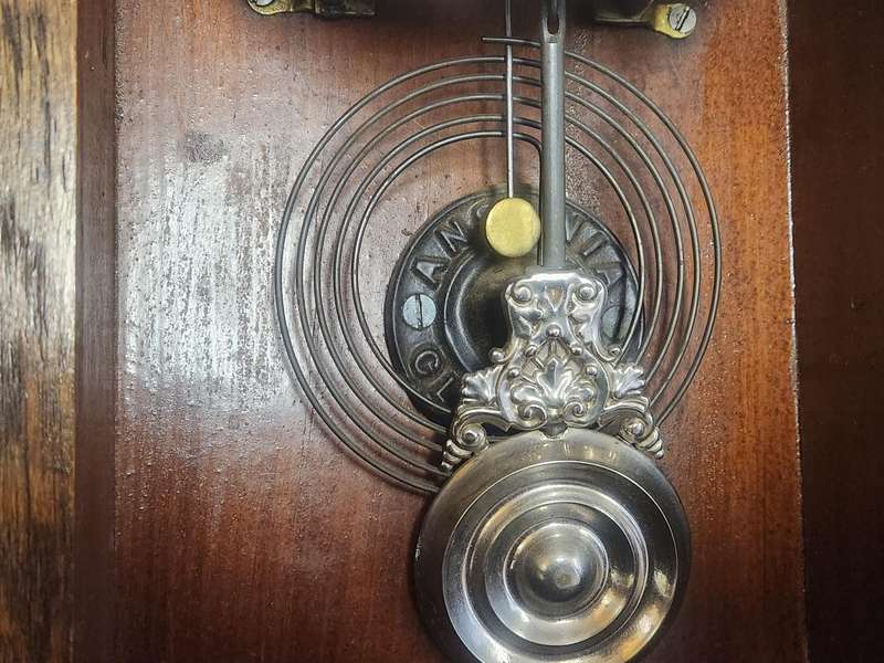 Vintage Ansonia Wall Clock in an Ornate Oak Casing