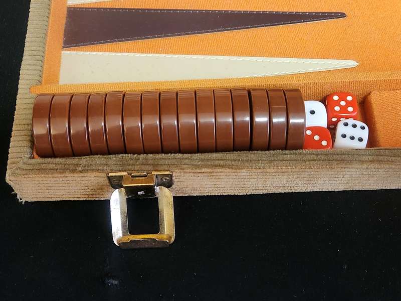 BACKGAMMON SET IN A CORDUROY BOUND CASE WITH FELT LINING
