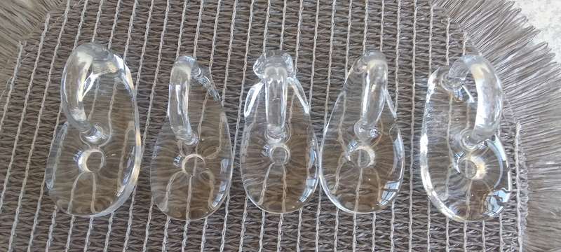 A Collection of Solid Clear Glass Candle Sticks Holders