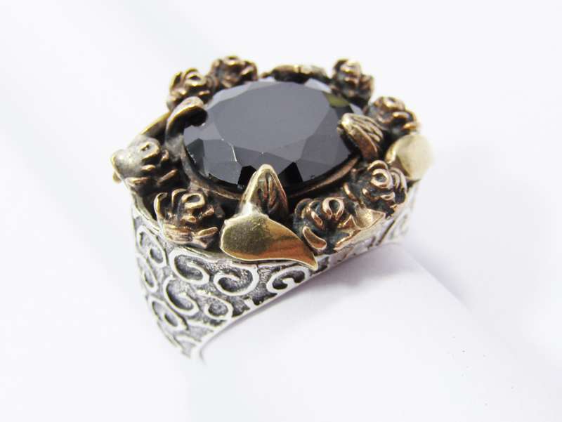A Beautiful Chunky Black Stone Ring With a Copper Detail over Sterling Silver