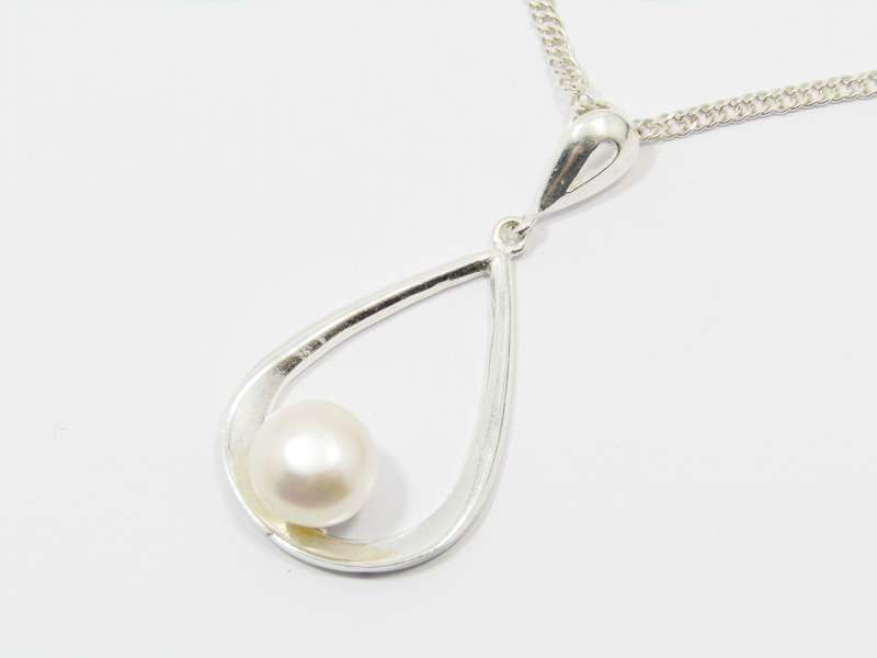 A Beautiful Large Teardrop Design Freshwater Pearl Pendant on Chain in Sterling Silver.