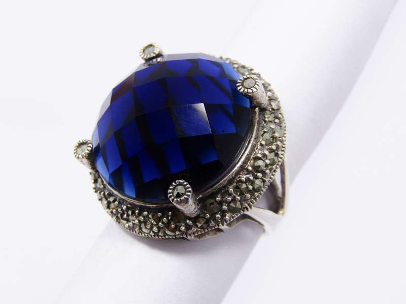 A Beautiful Large Faceted Blue Stone Ring With Marcasite's in Sterling Silver.