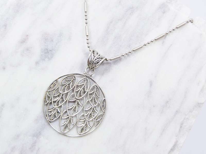 A Beautiful Large Round Leaf Design Pendant on Chain in Sterling Silver.