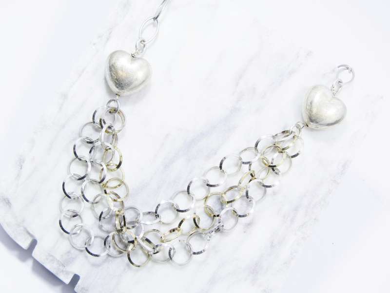 A Beautiful Puffy Heart Necklace Made up in Circles in Sterling Silver.