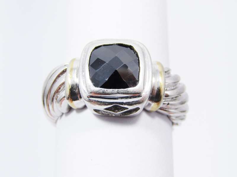 A Lovely Facetted Two Tone Black Stone ring in Sterling Silver.