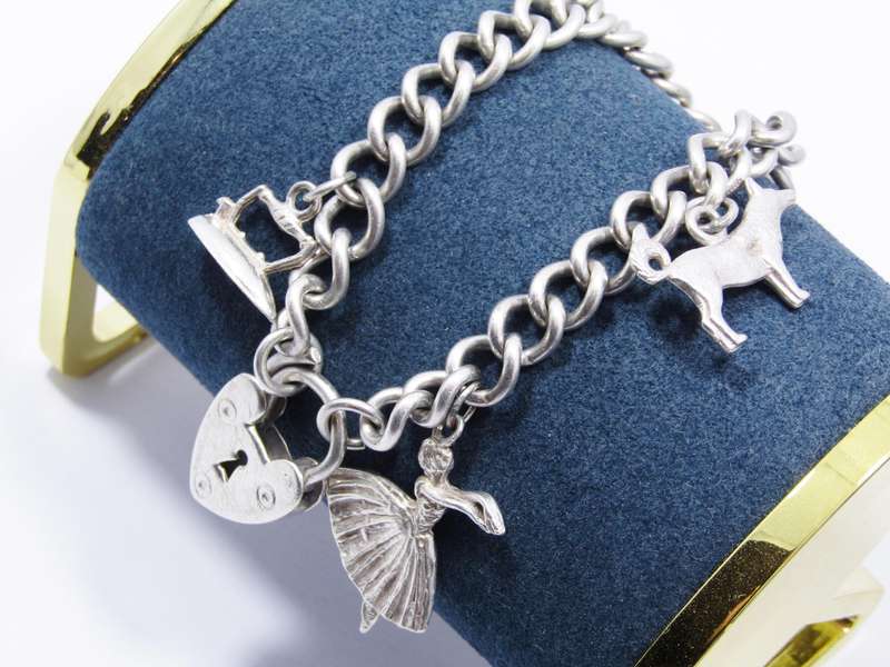 A Stunning Vintage Charm Bracelet With a Padlock Clasp in Sterling Silver