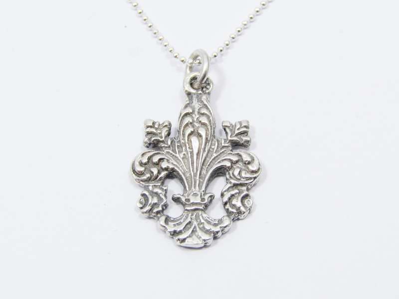 A Stunning Fleur De Lis Pendant on chain in Sterling Silver.