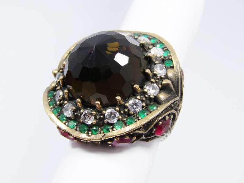 A Gorgeous Huge Facetted Smokey Color Crystal Surrounded With Pink Green and Clear Crystals in Sterl