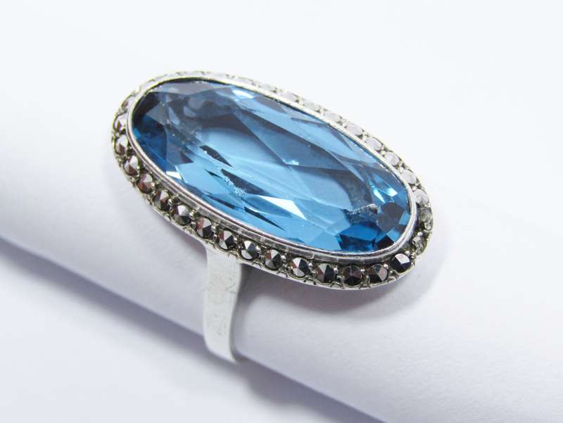 A Gorgeous Vivid Blue Synthetic Spinal Ring Surrounded with Marcasite's in Sterling Silver