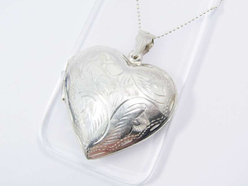 A Stunning Large Engraved Heart Locket On Chain in Sterling Silver.