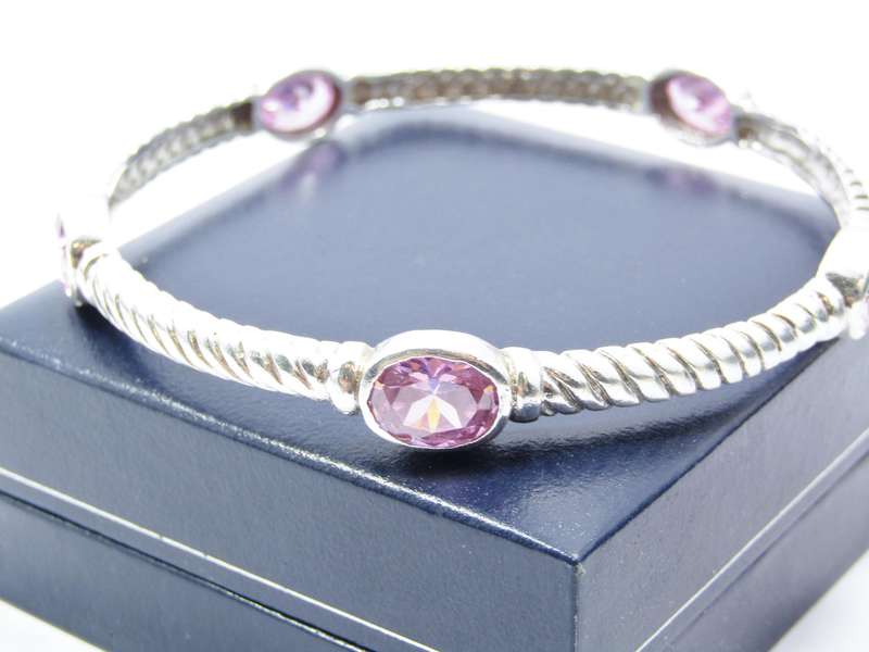 A Gorgeous Weight Pink Stone Bangle in Sterling Silver.