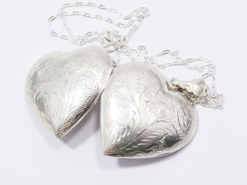 A Beautiful Vintage Design Engraved Heart Locket on Chain in Sterling Silver.