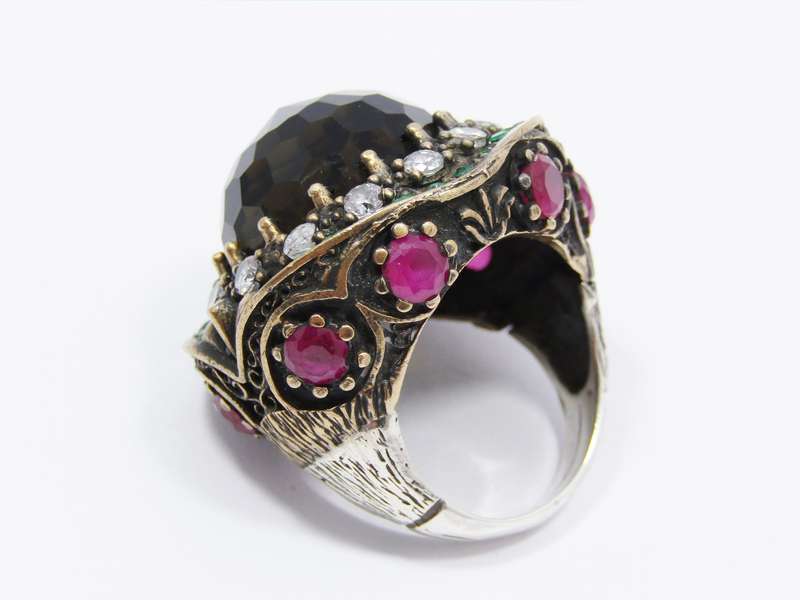 A Gorgeous Huge Facetted Smokey Color Crystal Surrounded With Pink Green and Clear Crystals in Sterl