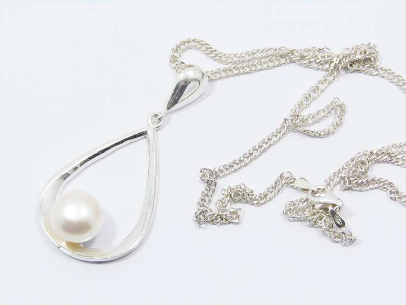 A Beautiful Large Teardrop Design Freshwater Pearl Pendant on Chain in Sterling Silver.