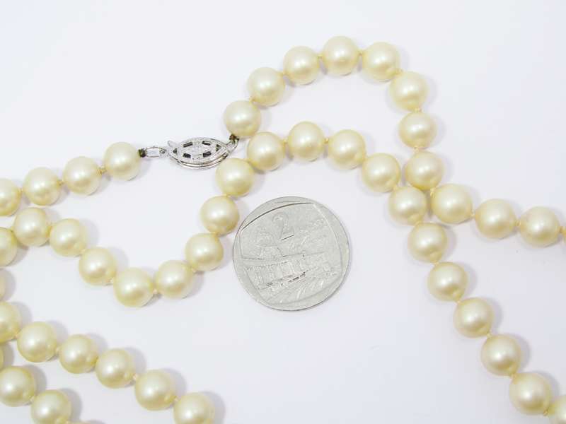 A Lovely String of  Vintage Faux Pearls with a Sterling Silver Clasp